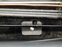 Accelerator tube bracket interfering with seatbelt mount.