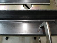 1/4 inch steel rod on edge.