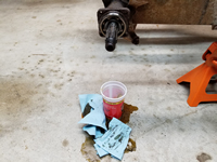 Transmission Oil Spilled on the Floor on Passenger Side After Removing Bearing Cover and Backing Plate.