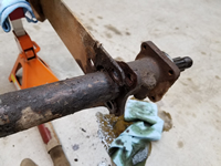 Passenger Side Spring Plate Unbolted From Axle Tube.