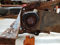 Driver Side Spring Plate Bushing Cover Removed.