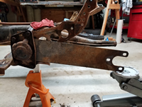Cover Plate Back On and Tension Applied to Spring Plate with Floor Jack.