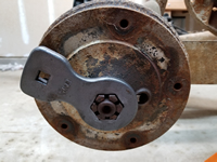 Tire removed, ready to hammer the axle nut loose.