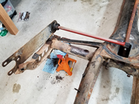 View of Driver Side Torsion Rod and Spring Plate.