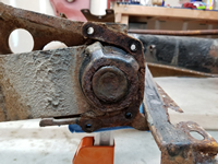 Passenger Side Spring Plate Bushing Cover Removed.