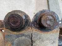 Spring Plate/Torsion Rods Joints. Passenger Side is Welded.