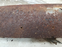 Close-up view of the rust on the top side of the upper header bow.