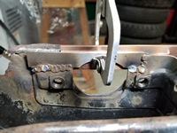 Inside view of pedal cluster support plate welds.